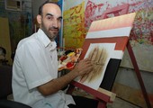 بالصور... الفنان ياسر الإسكافي في لوحات فنية للأبواب والنوافذ التراثية